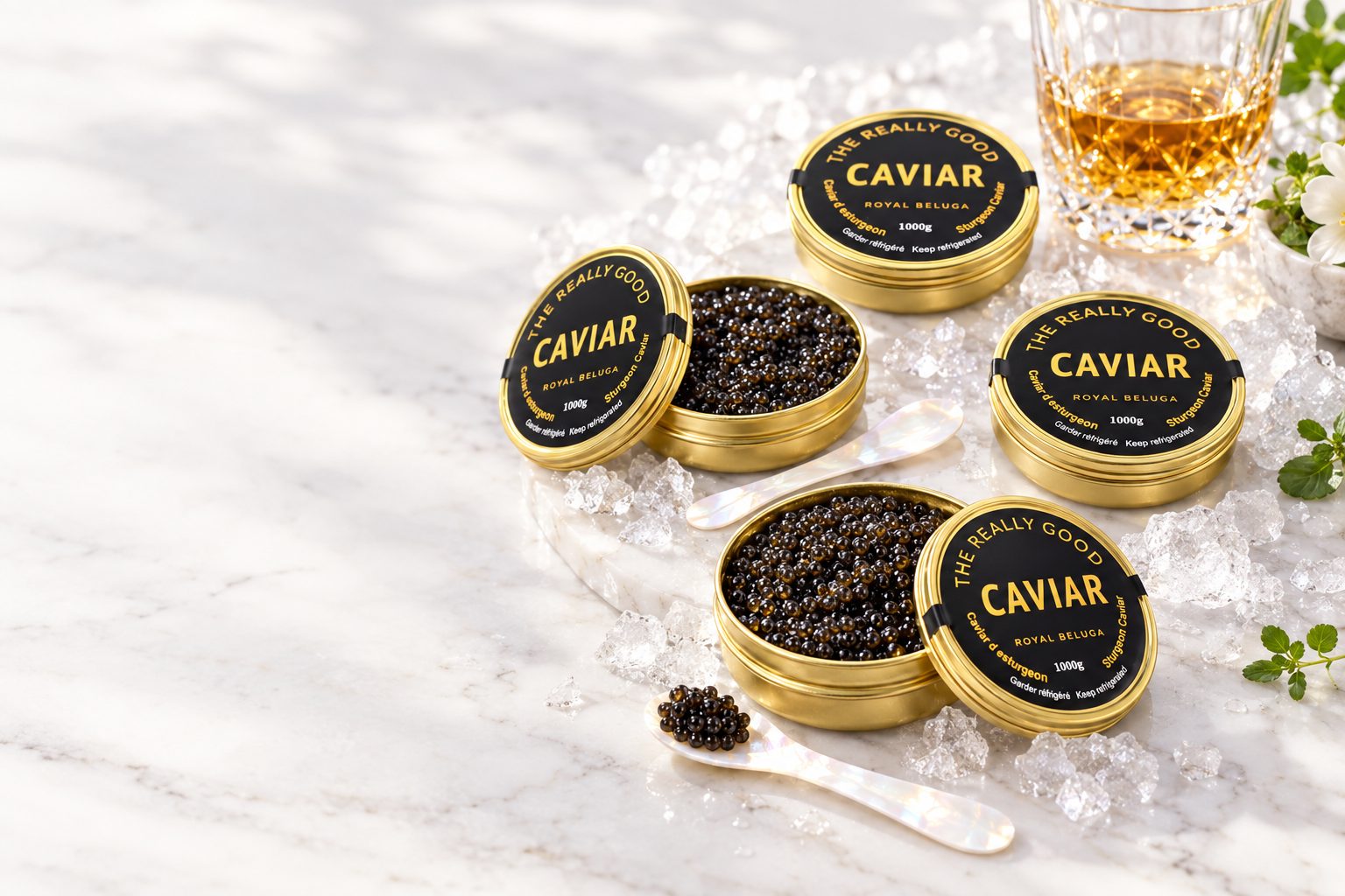 Five tins of The Really Good Caviar, two of them open, on white marble