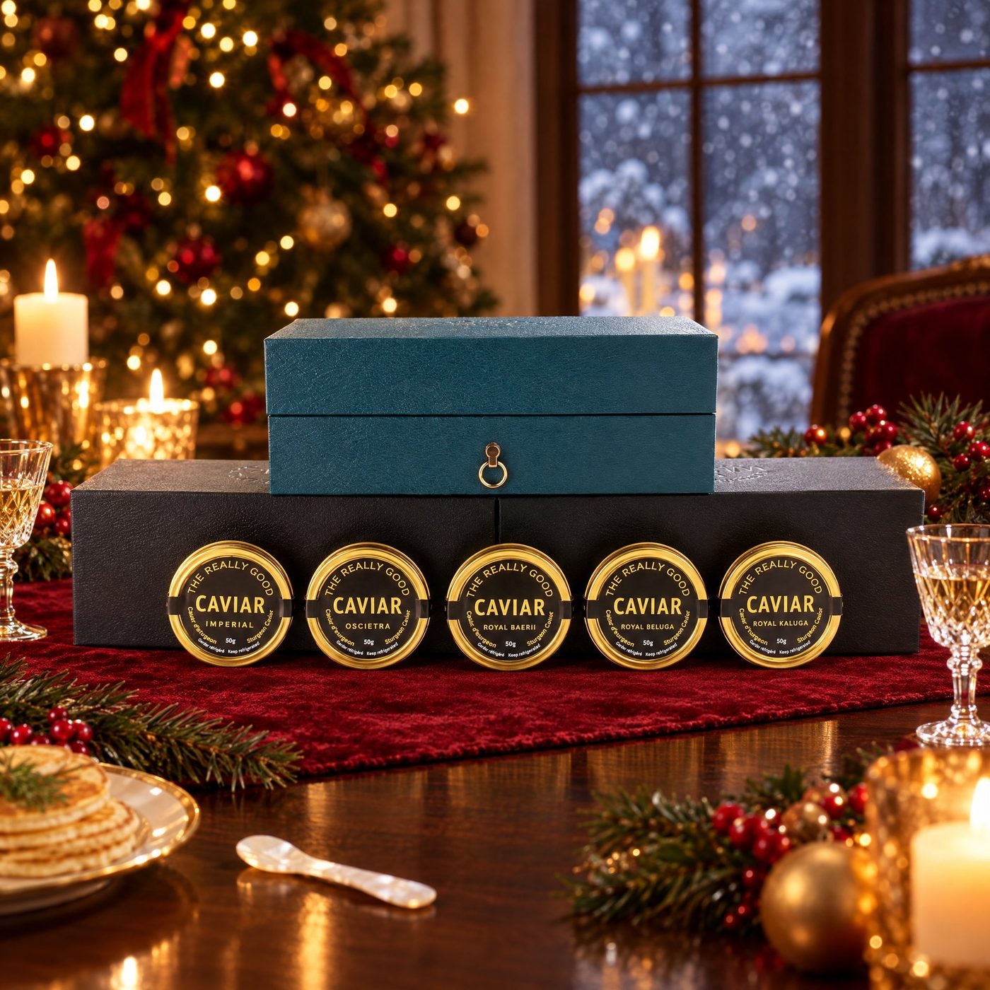 Five 50g caviar tins with a teal gift chest on a Christmas table