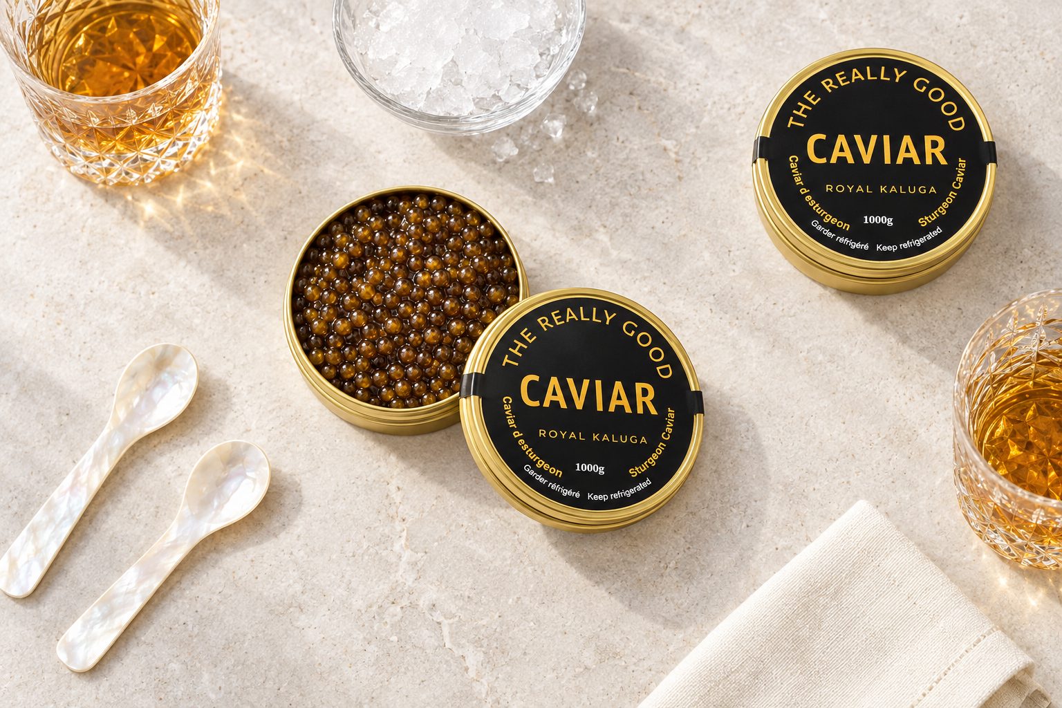 An open tin of caviar with two mother of pearl spoons